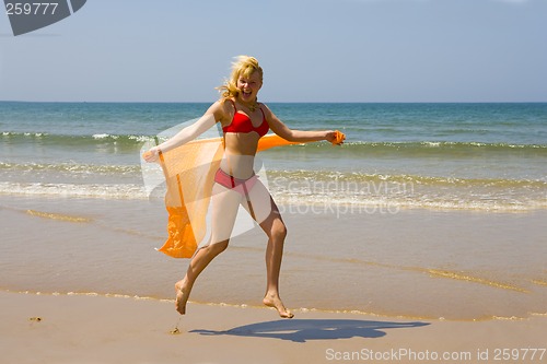 Image of Girl runs on beach