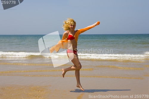 Image of Girl runs on beach