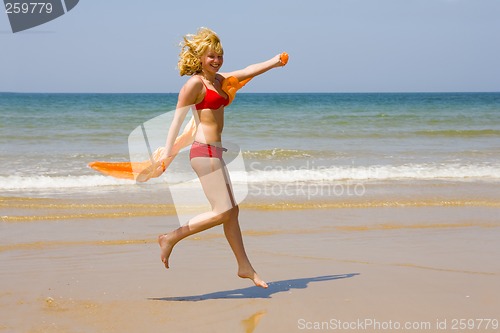 Image of Girl runs on beach