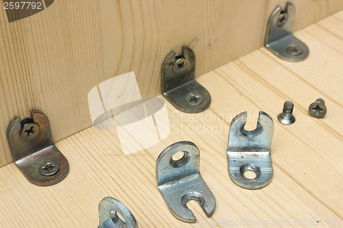 Image of Fastening metal details at manufacturing wooden furniture