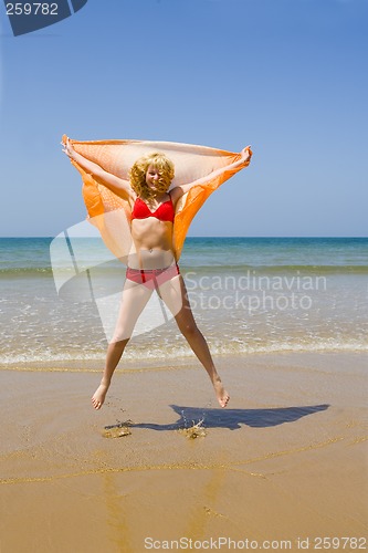 Image of Girl runs on beach