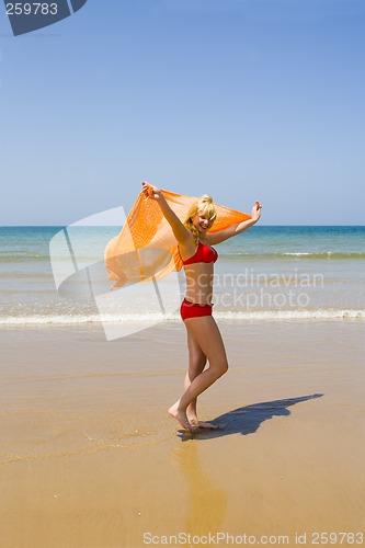 Image of Girl runs on beach
