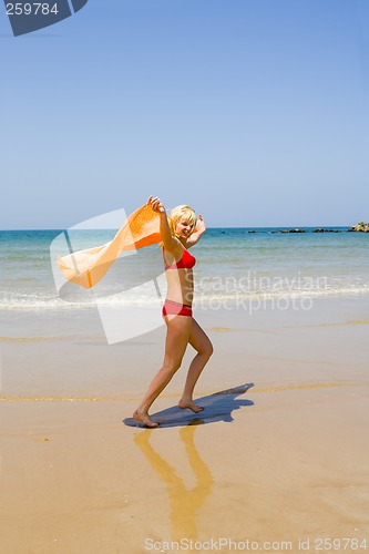 Image of Girl runs on beach