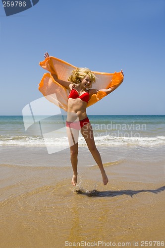 Image of Girl runs on beach