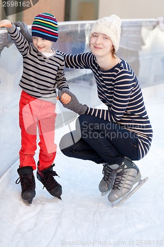 Image of family ice skating