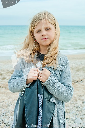Image of girl at the autumn beach 