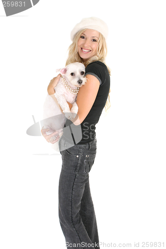 Image of Woman holding a small dog