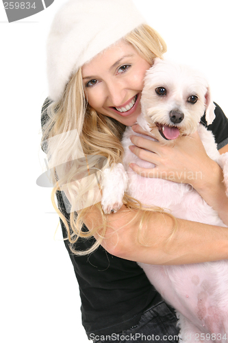 Image of Happy girl cuddling dog