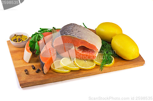 Image of Fish salmon, lemon, green on a white background.