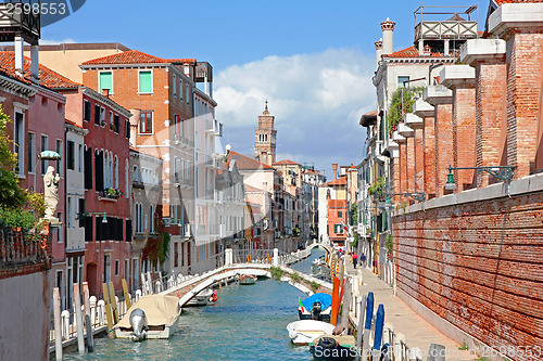 Image of Italy. Venice. Canal with bridge among old colorful brick houses