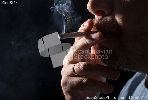 Image of Portrait man smoking cigarette