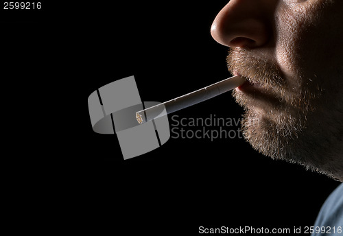 Image of Portrait man smoking cigarette