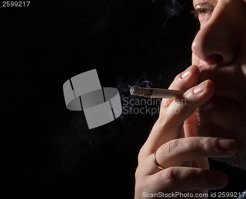 Image of Portrait man smoking cigarette