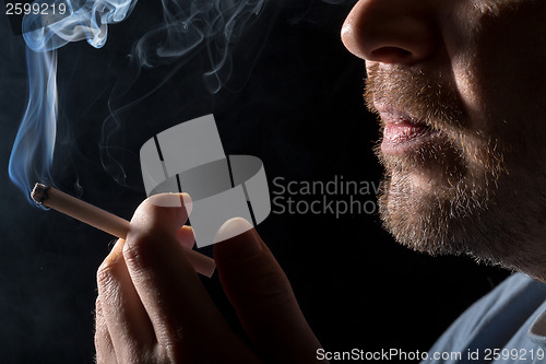 Image of Portrait man smoking cigarette