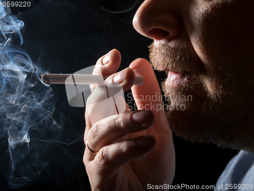 Image of Portrait man smoking cigarette