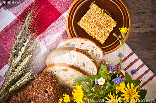 Image of Still life with honeycombs, flowers and pot 