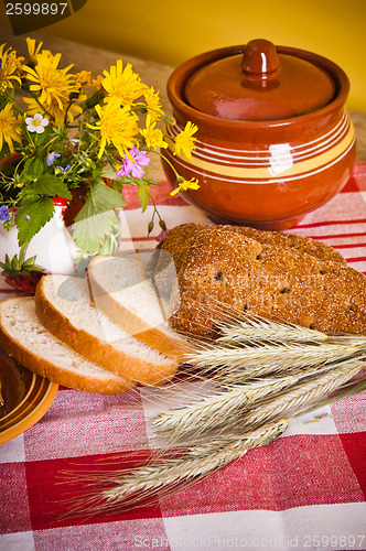 Image of Still life with honeycombs, flowers and pot