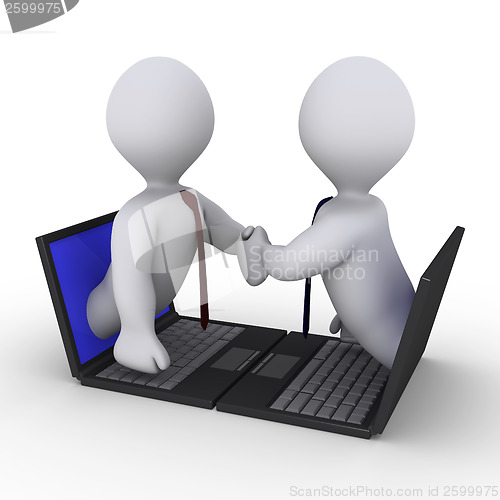 Image of Businessmen handshake through laptop