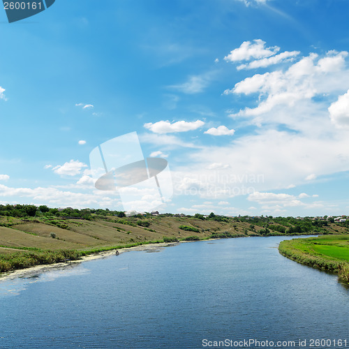 Image of view to river and clouds in blue sky