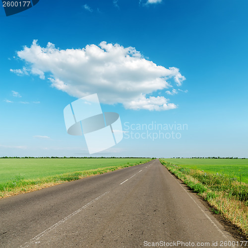 Image of white cloud over asphalt road