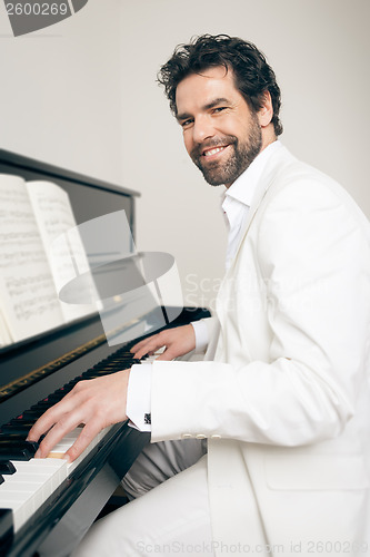 Image of man with piano
