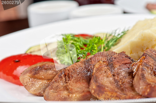 Image of tongue with grilled vegetable