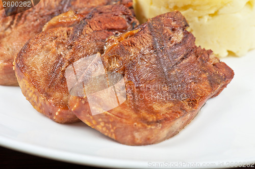 Image of tongue with grilled vegetable