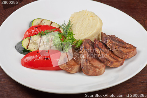 Image of tongue with grilled vegetable
