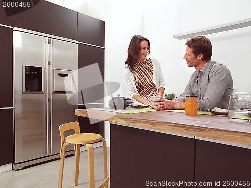 Image of couple in the kitchen aa