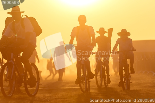 Image of Golden sunset with many people