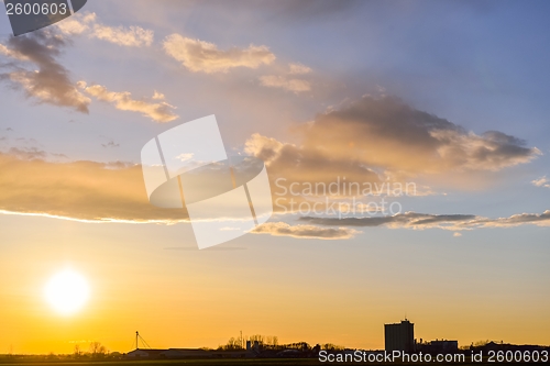 Image of Artistic sunset with bright sky and clouds