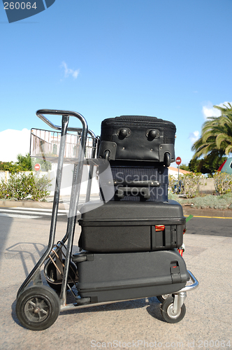 Image of Cart an many suitcases