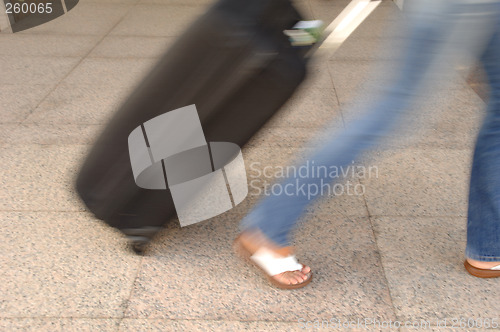 Image of woman and suitcase