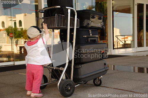 Image of Child and suitcases