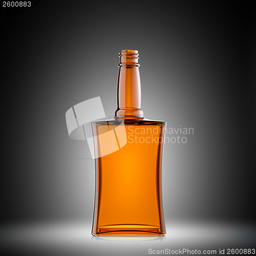 Image of Empty red glass bottle for scotch or brandy