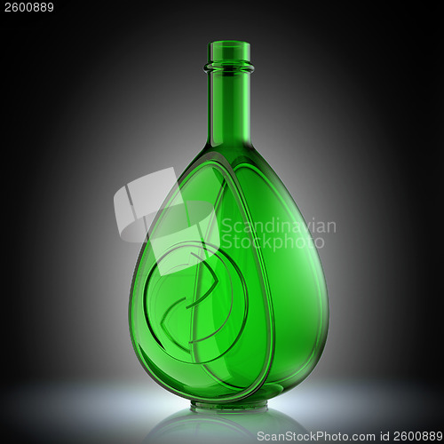 Image of Ecology and recycle concept with glass bottle and recycling symb