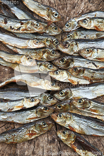 Image of Plenty of small dried fishes on a stack