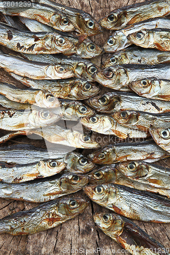 Image of Plenty of small dried fishes on a stack