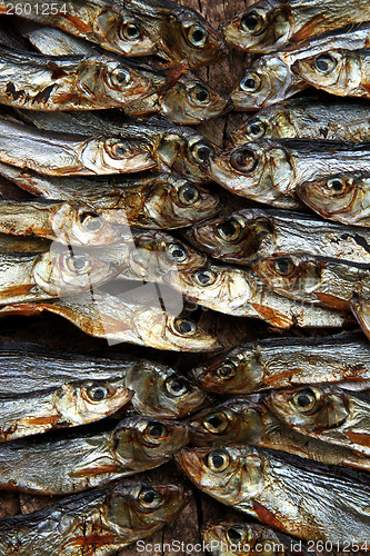 Image of Plenty of small dried fishes on a stack