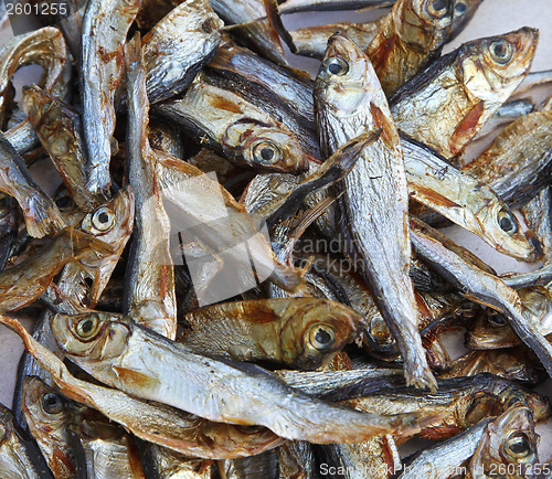Image of Plenty of small dried fishes on a stack