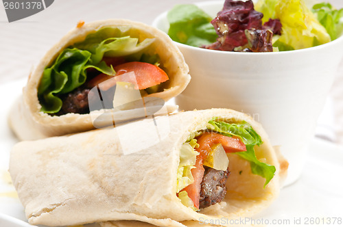 Image of kafta shawarma chicken pita wrap roll sandwich