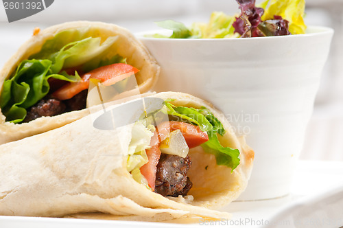 Image of kafta shawarma chicken pita wrap roll sandwich
