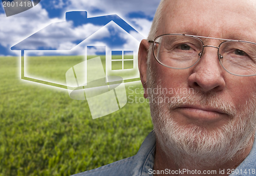 Image of Melancholy Senior Man with Grass Field and Ghosted House Behind