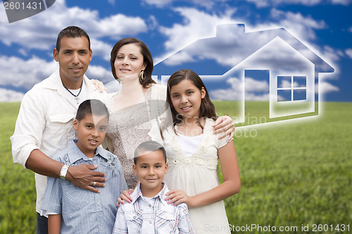 Image of Hispanic Family Standing in Grass Field with Ghosted House Behin