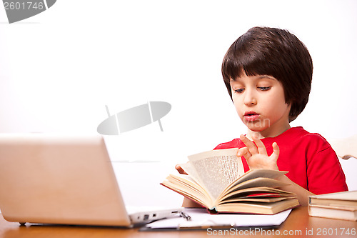 Image of child reading a textbook