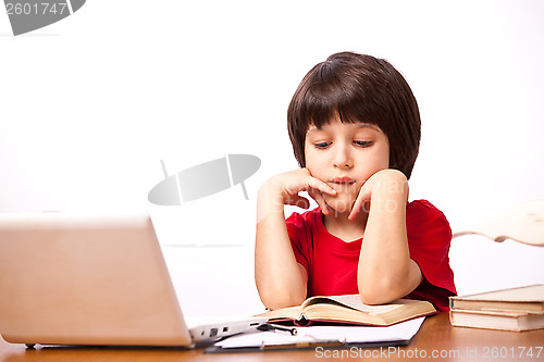 Image of child reading a textbook