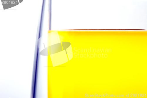 Image of edge of a glass with a drink on a white background