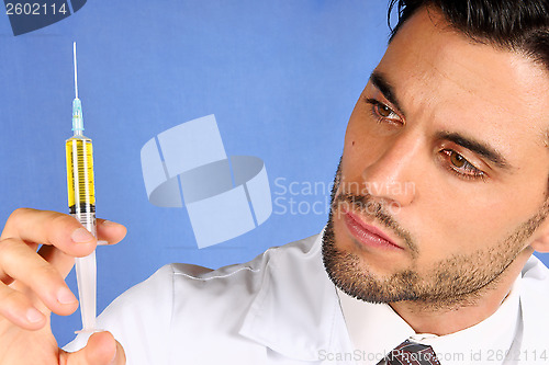 Image of Doctor holding syringe