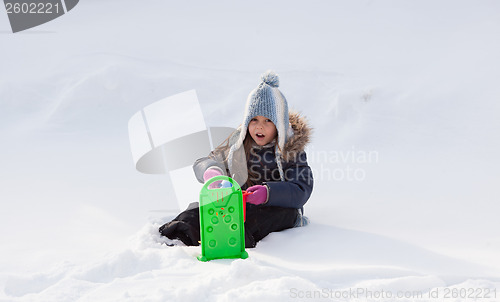 Image of Little girl playing in snow