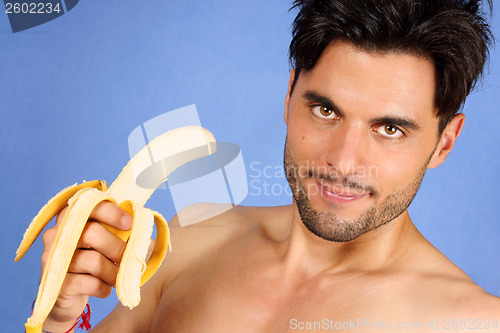 Image of Handsome man with banana